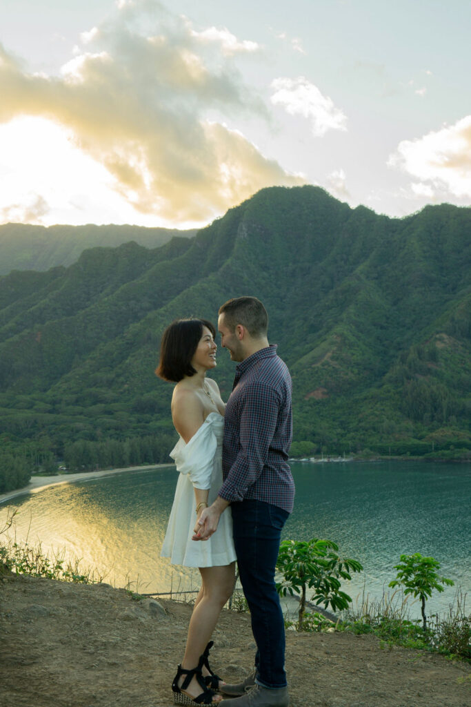 Couple dancing on the edge of Crouching Lion Hike in Oahu